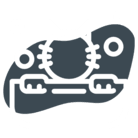 Cat peeking over a book with round glasses and paws visible.