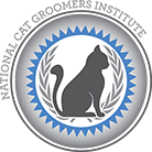 Emblem featuring a silhouette of a sitting cat surrounded by laurel leaves and a blue and gray border.